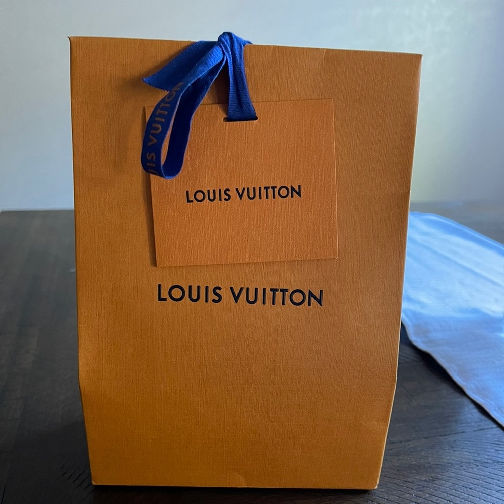 Authentic Louis Vuitton shopping bag with card slot and ribbon